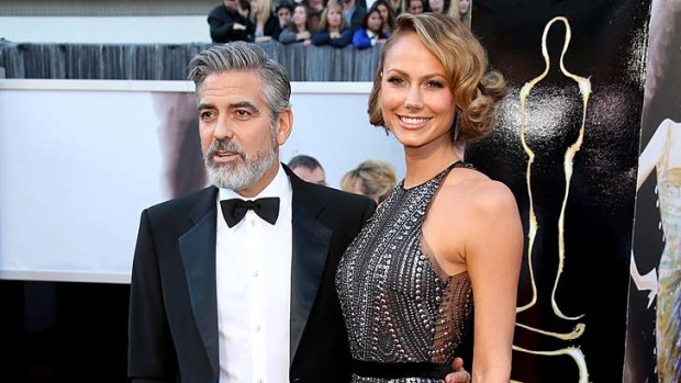 George Clooney and Stacy Keibler arrive at the 85th Annual Academy Awards at Hollywood & Highland Center on February 24, 2013 in Hollywood, California.