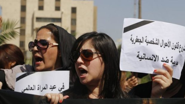 Opposed: Protesters demonstrate against the draft of the Al-Jafaari Personal Status Law in Baghdad. 