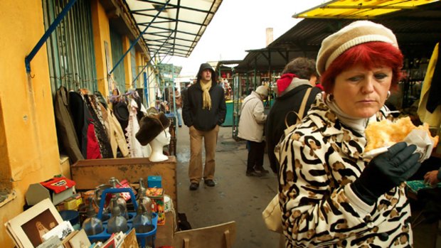 A woman walks through the Esceri flea market on the poorer outskirts of Budapest. Hungary has warned of a new Iron Curtain forming unless there is a massive bail-out.