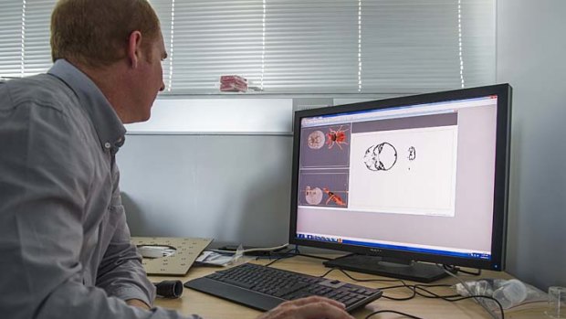 ANU Head of Applied Maths, Professor Tim Fendon, prepares a 3D file for printing.