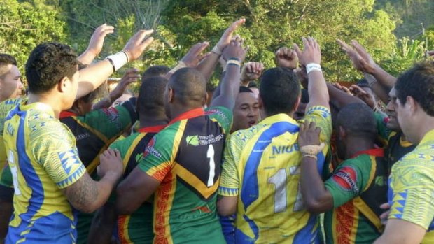 It's a kava-up: Vanuatu and Niue players celebrate after the final whistle. Niue were making their international rugby league debut and went down 22-20 in a thriller at Municipal Stadium.
