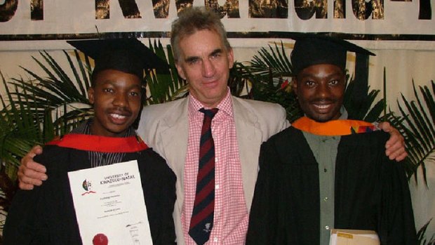 Roebuck with students he helped through university.