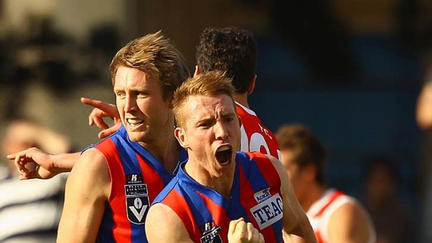 Port Melbourne's Patrick Rose celebrates kicking a goal in his team's win over the Bullants yesterday.