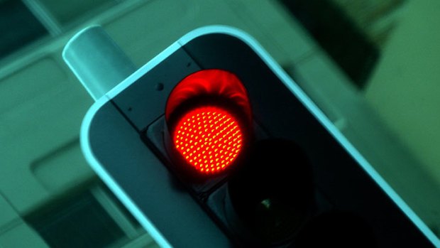 Motorists photographed at red light cameras may escape a fine.