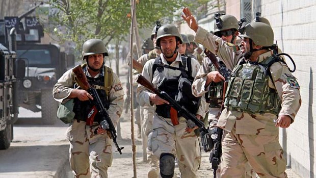 Afghan security forces take up positions in Kabul during the insurgent raids on the capital.