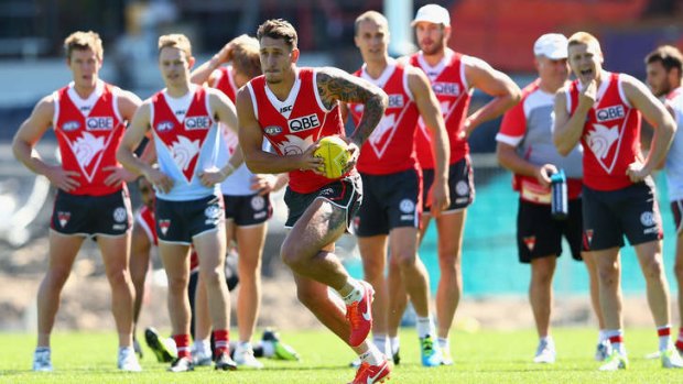 On the ball: Jesse White runs the ball during a Sydney Swans AFL training session at SCG this week.