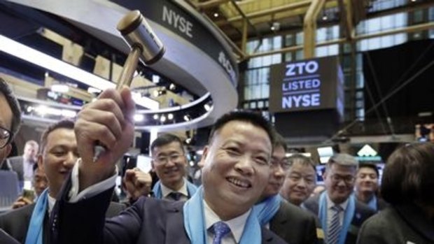 Happy days: ZTO Express founder Meisong Lai at the New York Stock Exchange trading floor before his company's IPO in October.