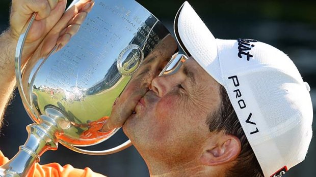 Greg Chalmers of Australia kisses the Kirkwood Cup after winning the 2011 Australian PGA Championship.
