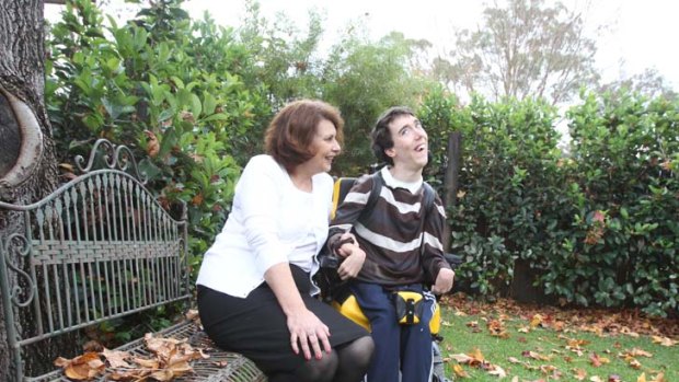 "The picture is just so gruesome" ... Sue O'Reilly, with her son Shane who has cerebral palsy, says the system is in complete crisis.