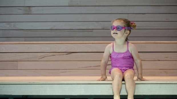 A young swimmer takes a dip in The Pool installation by Aileen Sage Architects'  in the Australian Pavilion at the 2016 Venice Architecture Biennale.