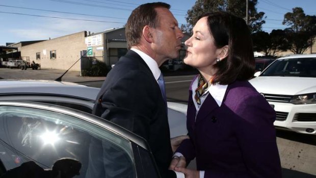 Opposition Leader Tony Abbott greets Liberal candidate Sarah Henderson.