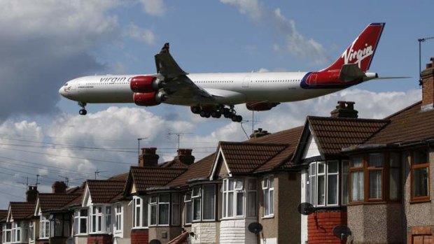 A Virgin Atlantic aircraft comes in to land at Heathrow Airport.