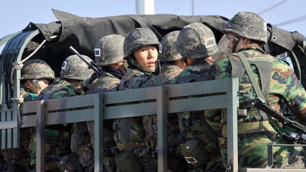 On the move: South Korean soldiers near the border city of Paju.