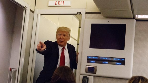 Obama did it: US President Donald Trump speaks to reporters aboard Air Force One before landing in Maryland last week.