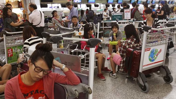 Travel chaos: Hong Kong Airport cancels flights ahead of typhoon Usagi.