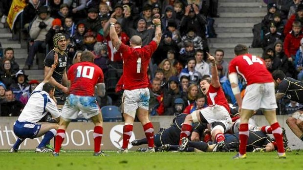 Wales players celebrate after Richard Hibbard scores the only try.