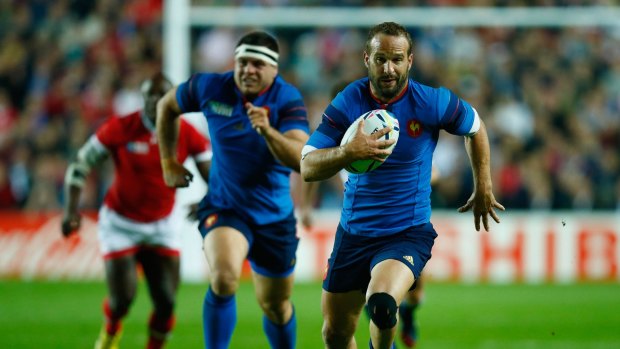 Confident: Frederic Michalak finds space during France's match against Canada. 