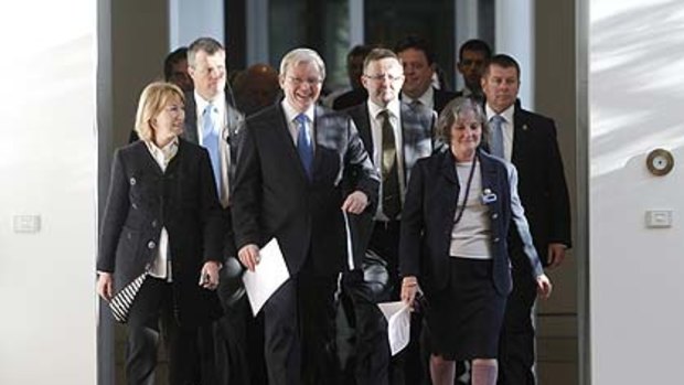 A smiling Kevin Rudd arrives for the spill vote.