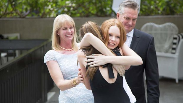 Dream comes true &#8230; Grace Simmons, centre, hugs her sister Annie as proud parents Blane and Adrienne look on.