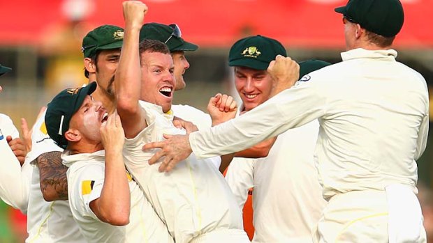 Peter Siddle celebrates after taking the wicket of Ian Bell.