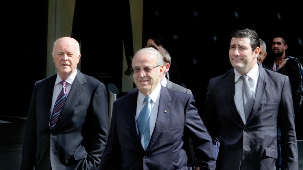 Eddie Obeid arriving at the ICAC hearing flanked by his lawyers , including Stuart Littlemore, in 2013