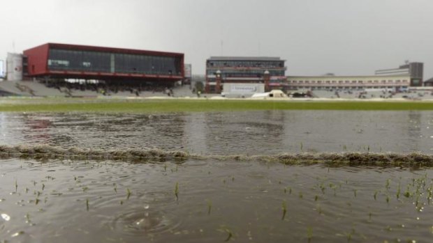 Wet day, no play: a rain-sodden Old Trafford after play was stopped during the fourth Test between England and India in Manchester.