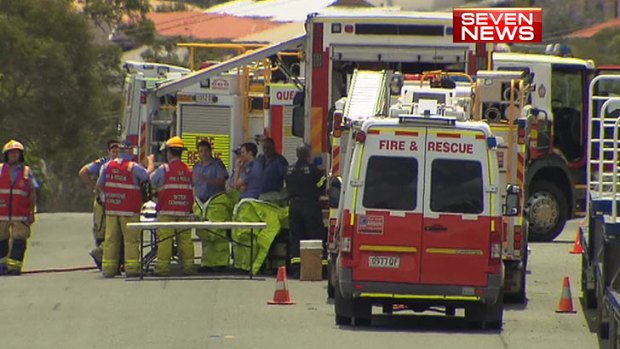 Emergency crews at the scene of a chemical spill at Heathwood, near the Logan Motorway.