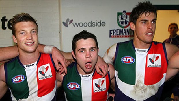 Dockers Rhys Palmer, Hayden Ballantyne and Garrick Ibbotson celebrate the win over Melbourne.