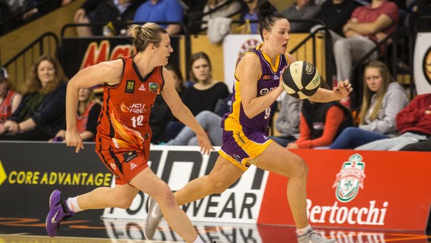 Boomer Tess Magden races Mia Murray of the Townsville Fire down the court.