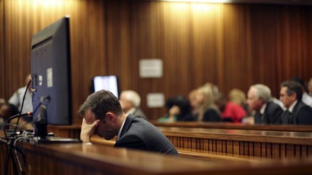 On trial: Oscar Pistorius reacts in court.