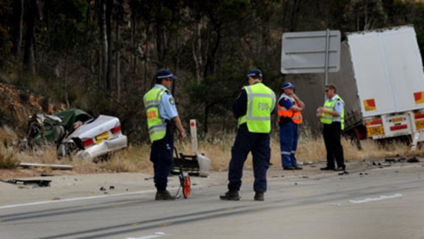 Head-on smash ...  four young men died when  their car collided with a truck near Yass.
