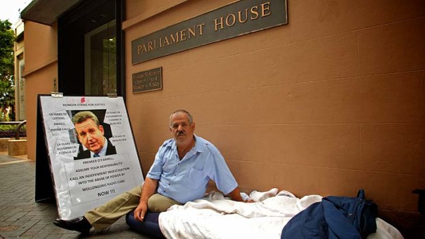 Taxi driver Abdula Ganiji, pictured protesting outside Parliament House in December 2012.
