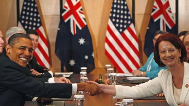 All smiles... US President Barack Obama and Prime Minister Julia Gillard at their first official meeting in Yokohama.