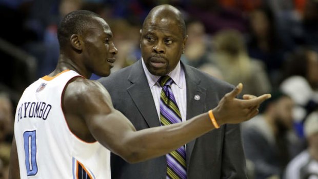 Charlotte Bobcats stand-in coach Patrick Ewing chats with centre Bismack Biyombo in the first half of an NBA basketball game against the New York Knicks in Charlotte.