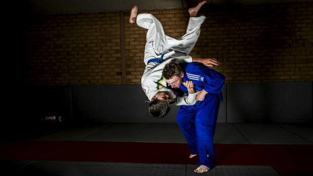 Samuel Dobb, 14, in blue, has been selected to represent Australia in Judo at the Youth Olympics.