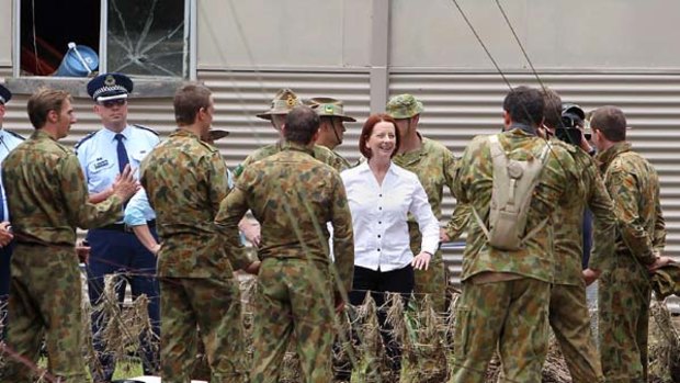Prime Minister Julia Gillard meets with soldiers helping out in the flood recovery in Grantham.