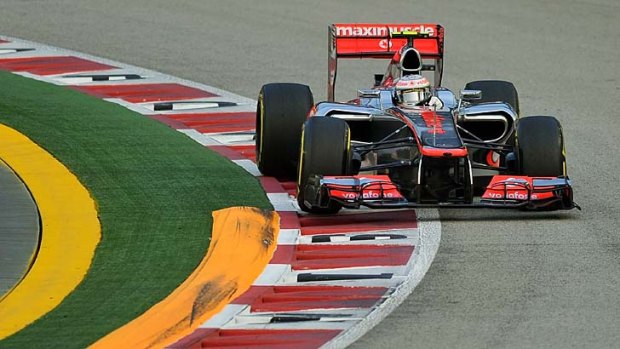Powering his car to pole ... McLaren Mercedes driver Lewis Hamilton