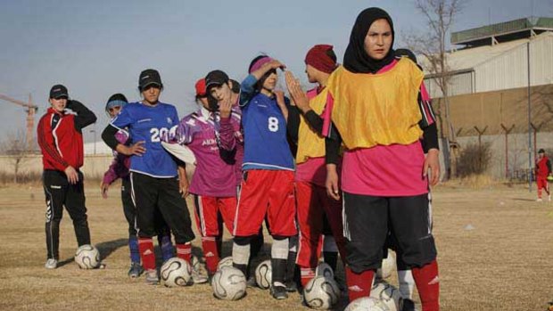 The Afghan women's soccer team practices in a stadium that is also used as a helipad in Kabul.