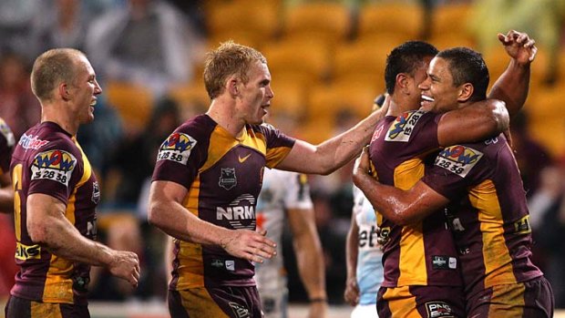 Josh Hoffman celebrates his 78th-minute try, taking the Broncos lead to 18 points.