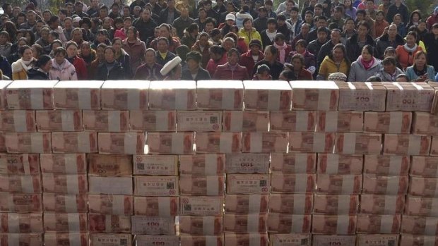 In the money: The wall farmers in Jianshe built with cash from their Lunar New Year bonuses.
