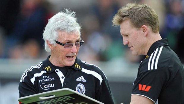 Succession strategy: Collingwood coach Mick Malthouse (left) with assistant Nathan Buckley at three-quarter-time against Carlton last Saturday.