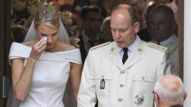 Princess Charlene wipes a tear after marrying Prince Albert of Monaco.