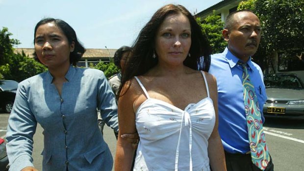 October 2004: Schapelle Corby lead by drug investigation officer to her prison cell after being caught with 4.2 kilograms of marijuana at Bali airport.