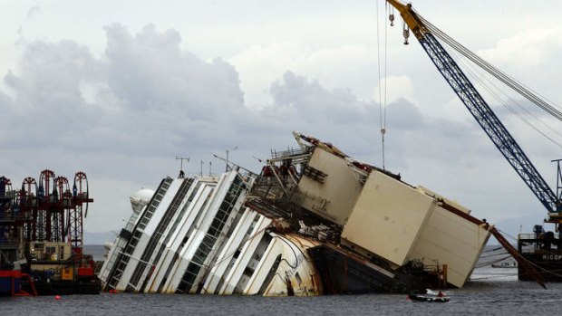 The Costa Concordia ship lies on its side on the Tuscan Island of Giglio, Italy. Authorities have given the final go-ahead to pull upright the crippled cruise liner from its side in the waters off Tuscany.