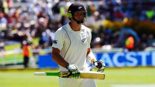 Horror day ... New Zealand's batsman Martin Guptill walks off after his dismissal.