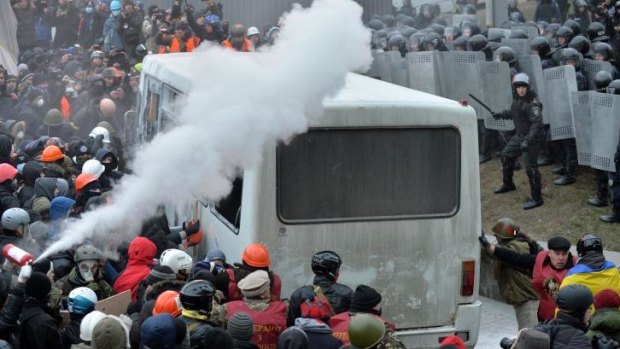 Protesters clash with police during an opposition rally.