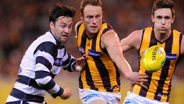 Jimmy Bartel, seen here battling with Hawthorn's Brad Sewell, says he is not sure a player coming on - 30 centimetres to a metre beforehand - really affects the outcome of the game.