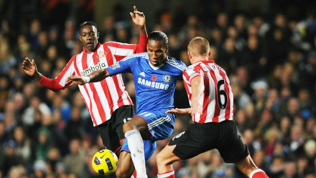 Didier Drogba takes on Sunderland's Lee Cattermole and Danny Welbeck.
