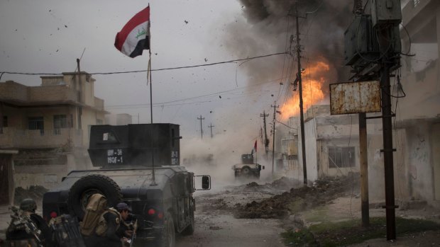 A car bomb explodes in Mosul, Iraq.
