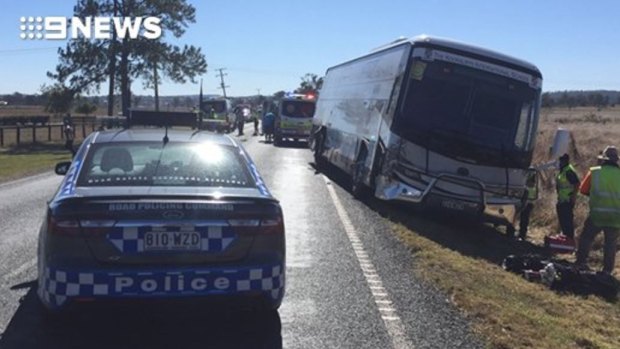 Emergency services at the scene of a ute and bus crash at Beaudesert.